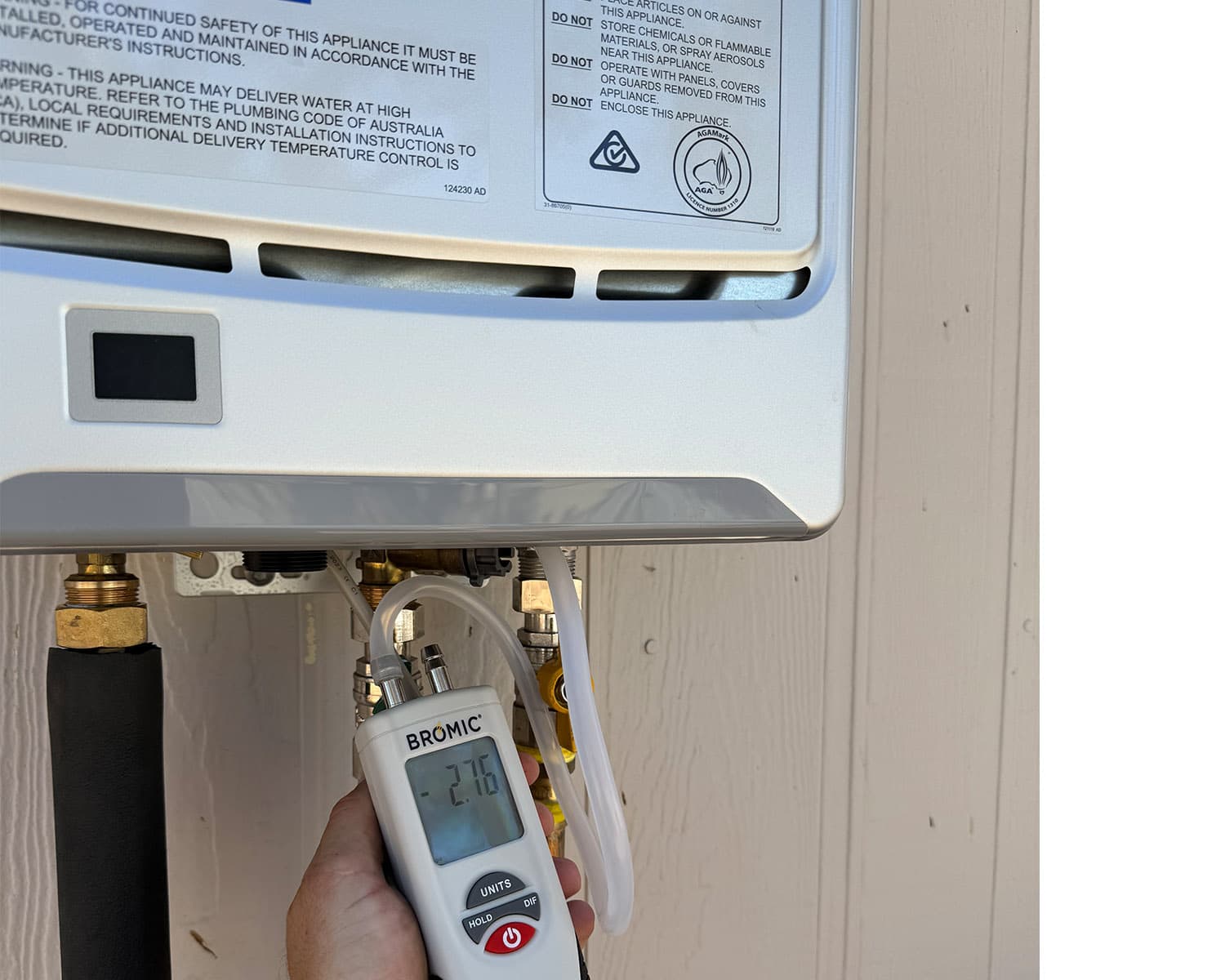 Gas appliance being pressure tested with a Bromic gas analyser after installation